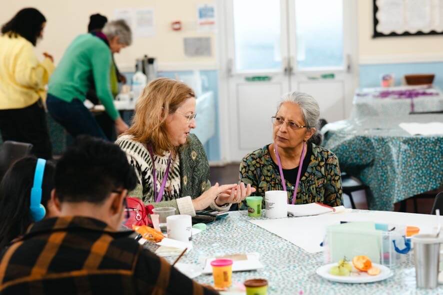 People learning together around a table